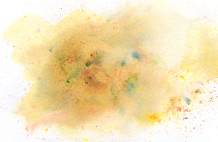 A test swatch of paint powder - Yellow Ochre.