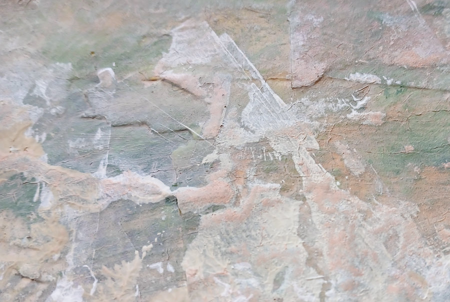 A close up of some of the textures created from the layers of mixed media art techniques. The main colours are pale pink, white and a grey-blue.