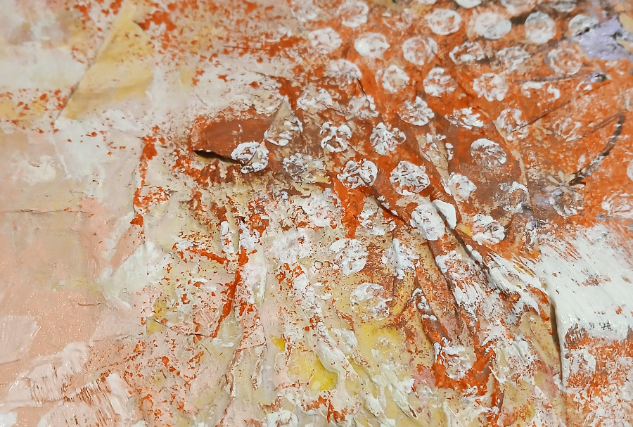 A close up of a stamped pattern created with bubble wrap and white acrylic paint.