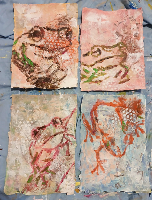 The four substrates showing the mixed media art techniques, with the painted frog outlines, by Ruth Burton Artist.
