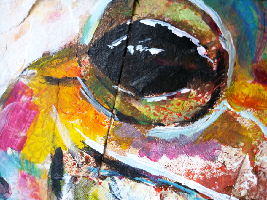 A close up of the mixed media art techniques used for the 'yellow' frog.