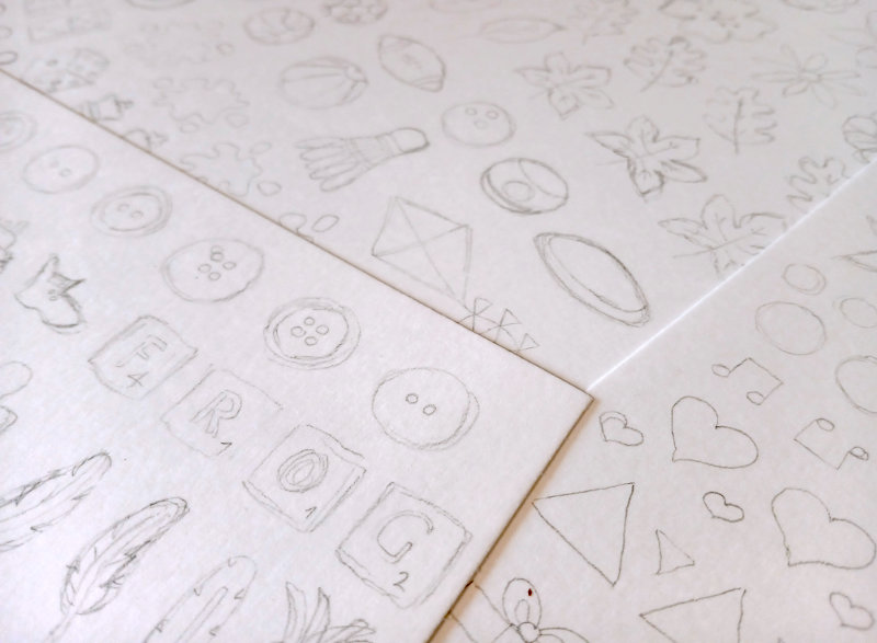 A close up of some of the pencil sketches of additional elements for the Frog's Bucket List greeting cards by Ruth Burton.