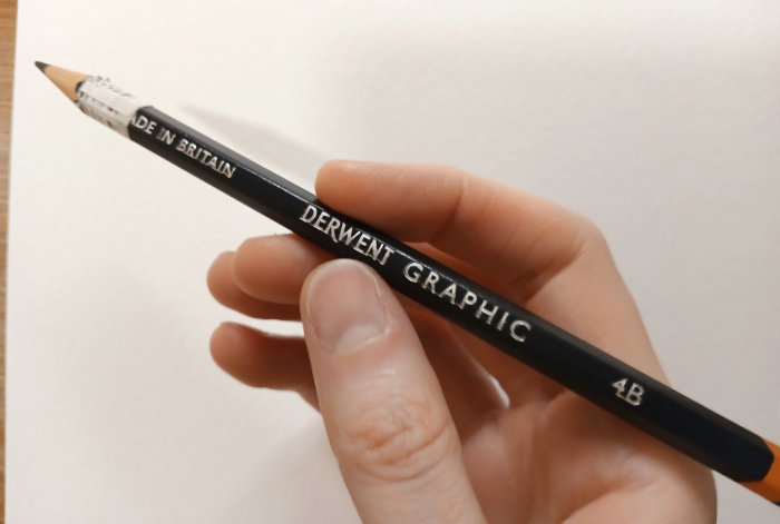 A photo of a Derwent Graphic 4B pencil - used to sketch Frog's Bucket List illustrations.
